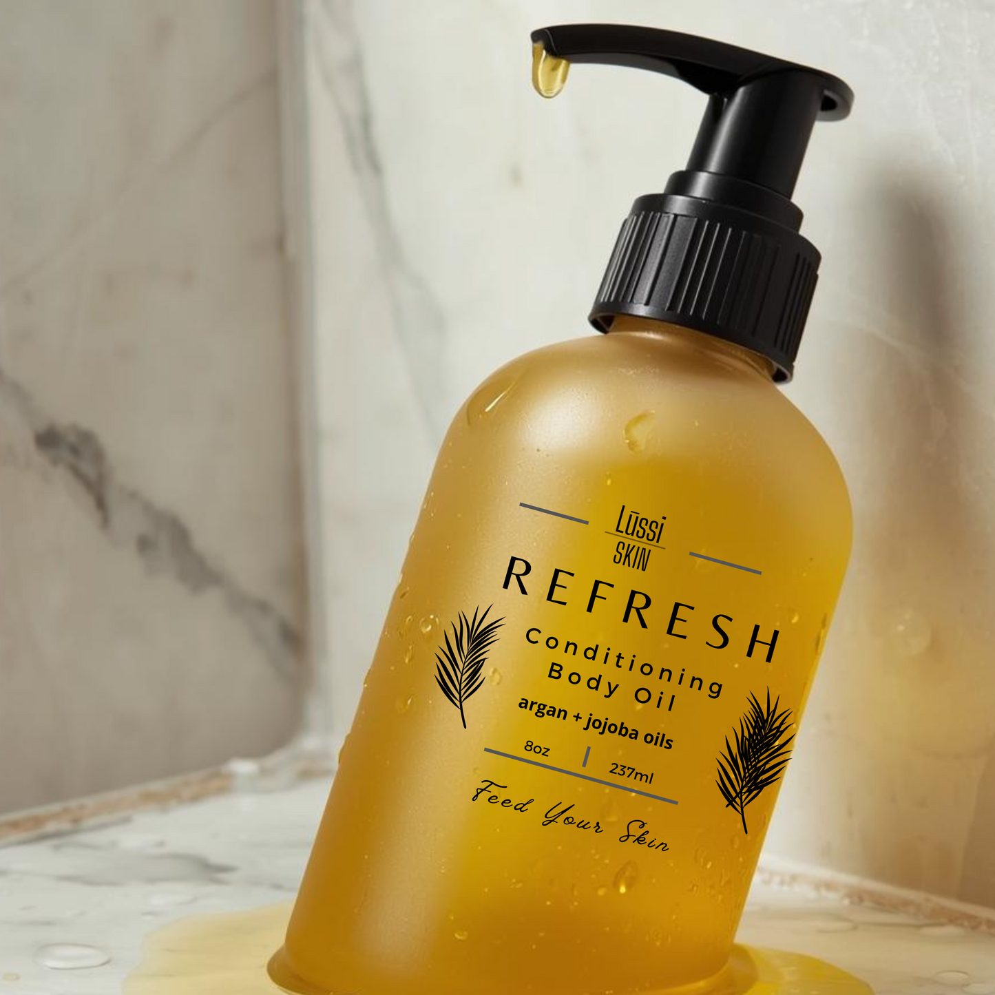 Yellow bottle of 'Refresh' conditioning body oil with black pump on a marble surface